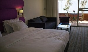 Habitación Deluxe, en el área del jardín | Ropa de cama de alta calidad y edredón 