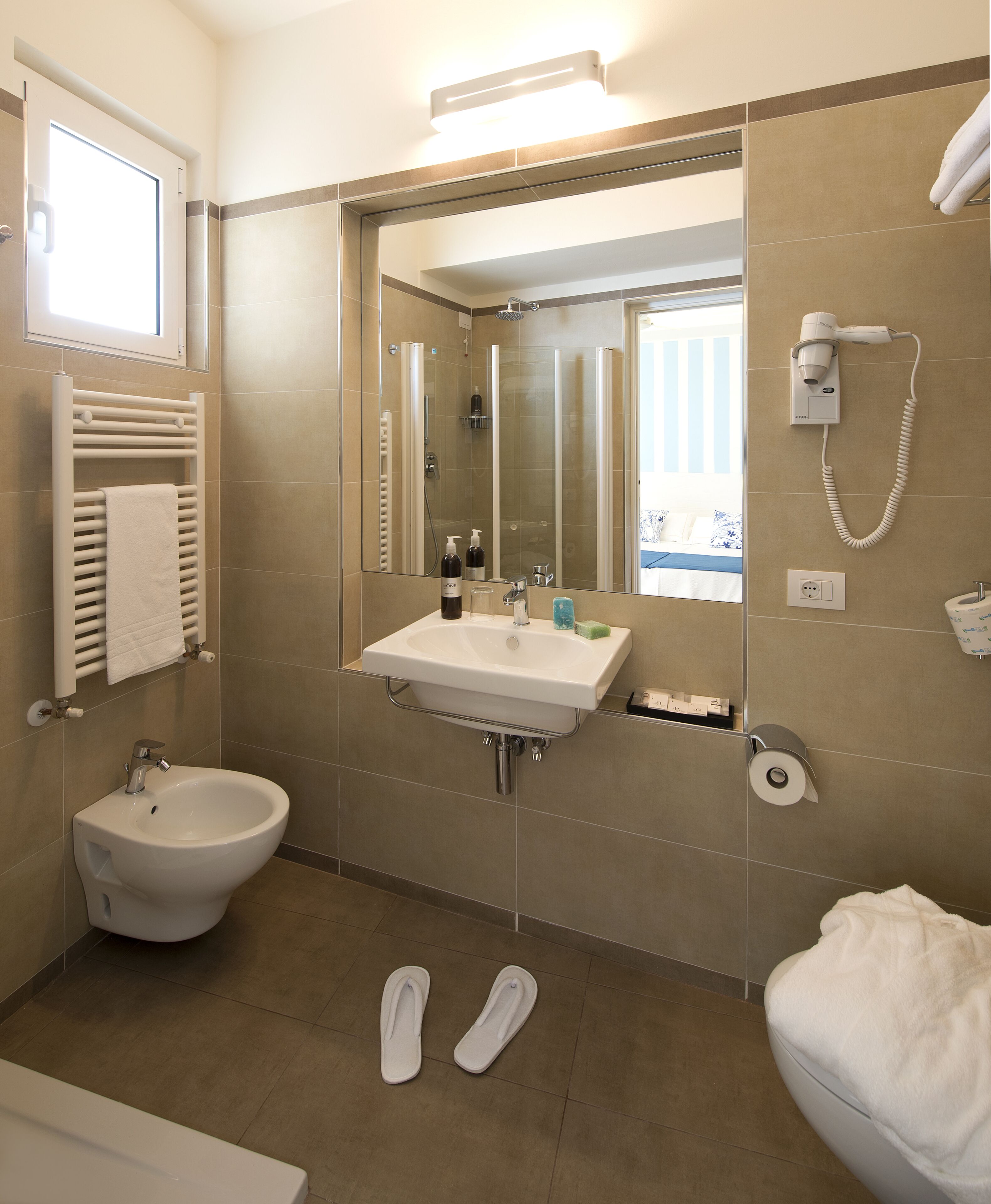 combined shower/bathtub, free toiletries, hair dryer, bathrobes