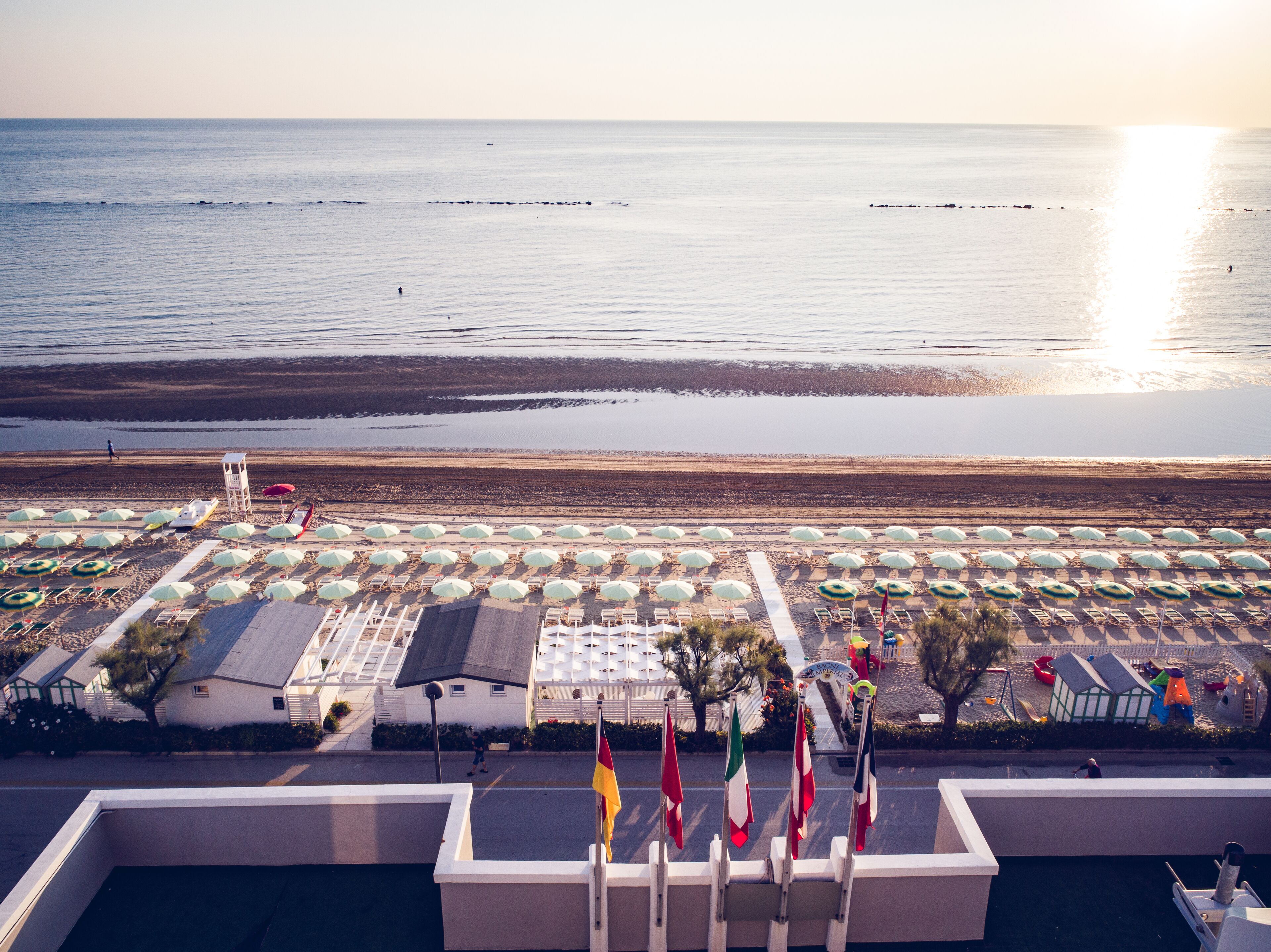 private beach, sun-loungers, beach towels, beach volleyball