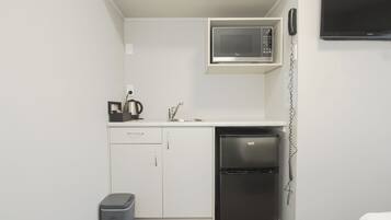Estúdio | Cozinha privada | Geladeira, micro-ondas, cafeteira/chaleira, chaleira elétrica