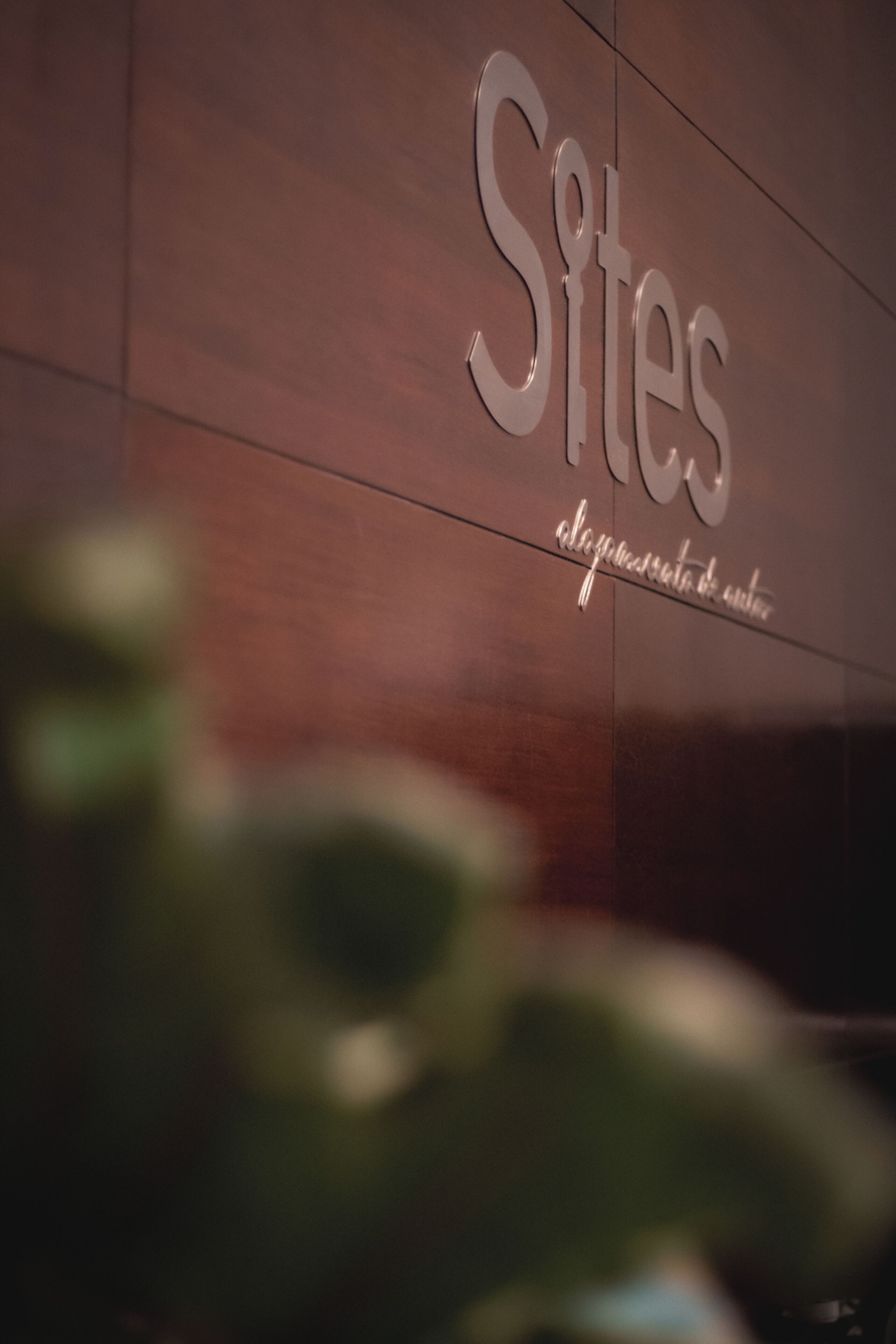 A sign with the word "Sites" and a tagline.