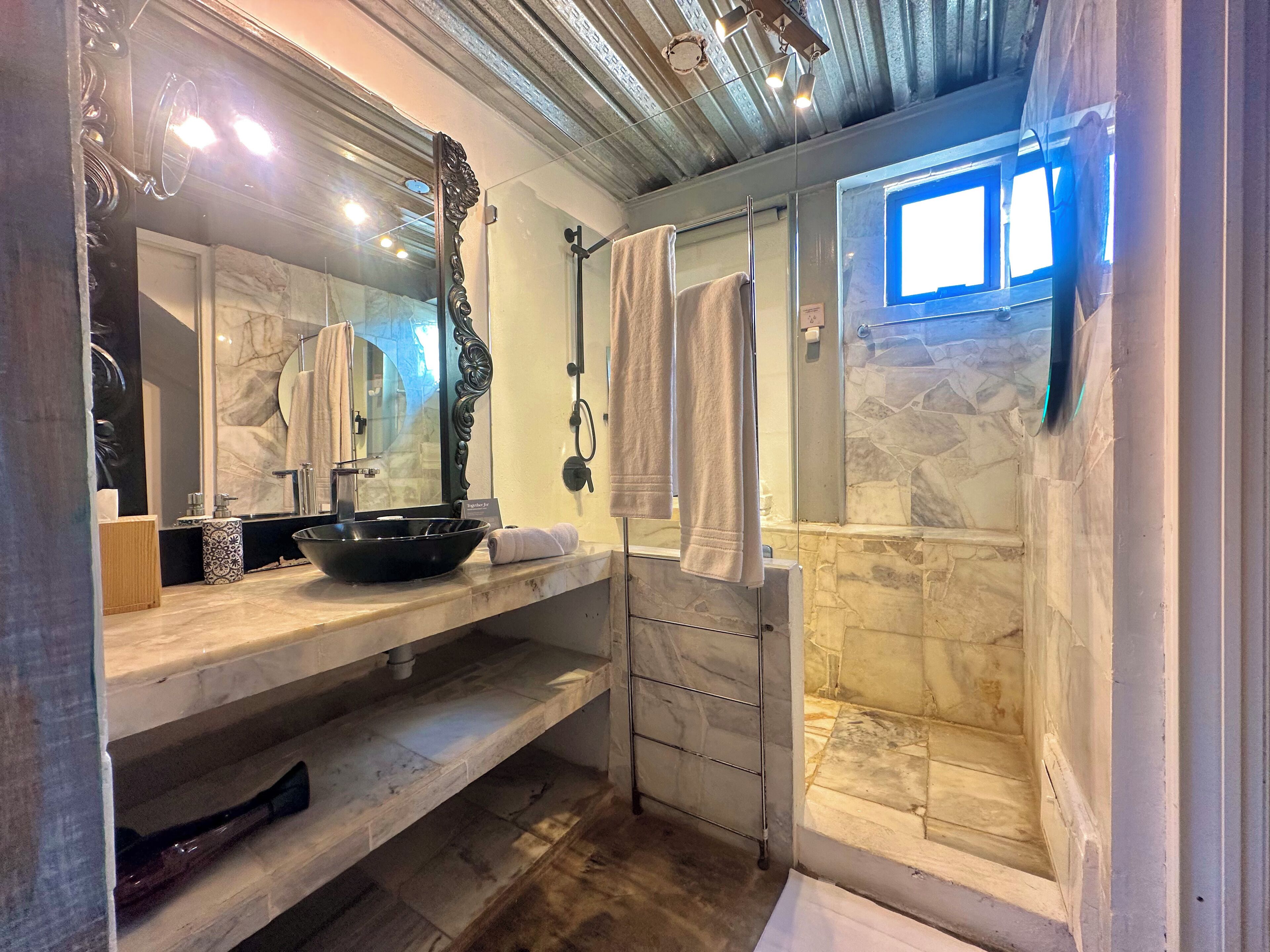 superior double room | bathroom | shower, eco-friendly toiletries, hair dryer, towels