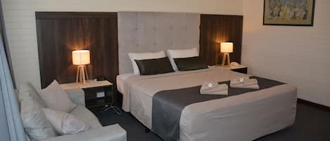 Deluxe King Room | Blackout drapes, iron/ironing board, free WiFi, bed sheets