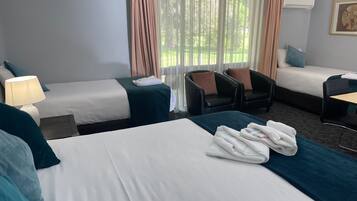 Deluxe Quadruple Room, Golf View | Premium bedding, pillow-top beds, desk, laptop workspace