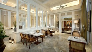 A spacious dining area with high ceilings, large windows, and a view of the dining room. - The Hermitage, A Tribute Portfolio Hotel, Jakarta (Jakarta)