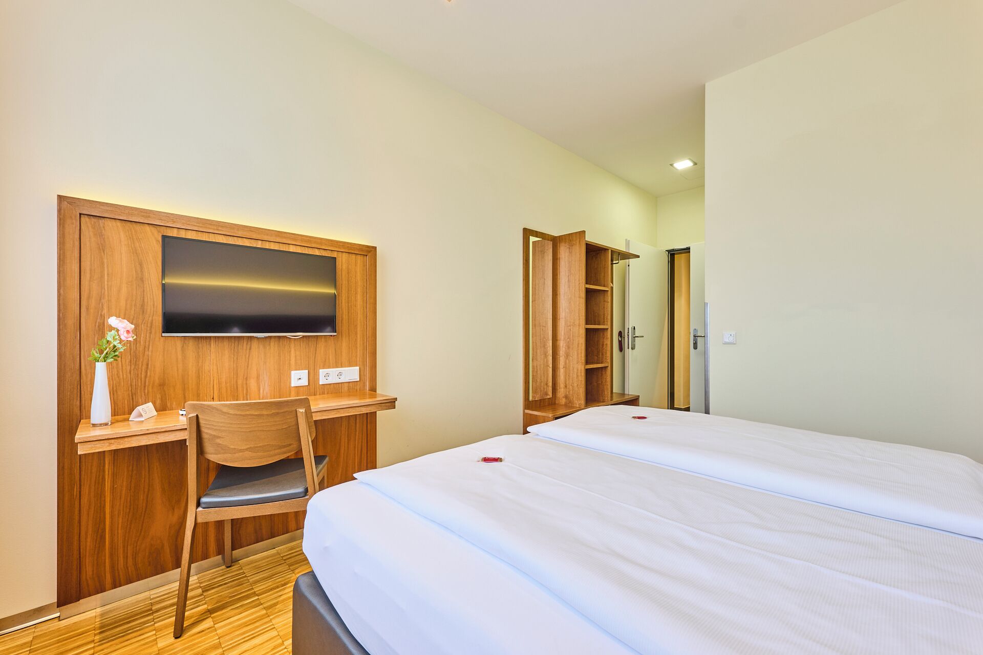 hypo-allergenic bedding, desk, laptop workspace, blackout curtains