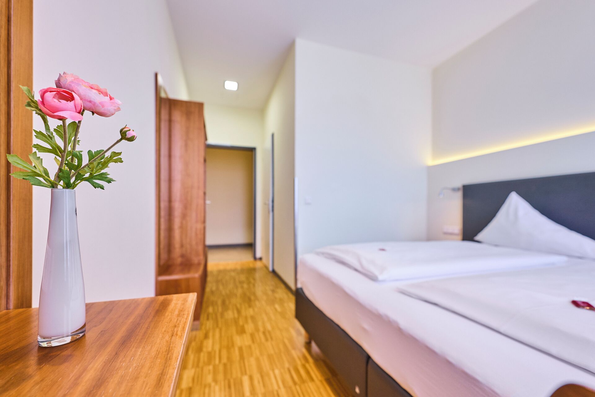 hypo-allergenic bedding, desk, laptop workspace, blackout curtains