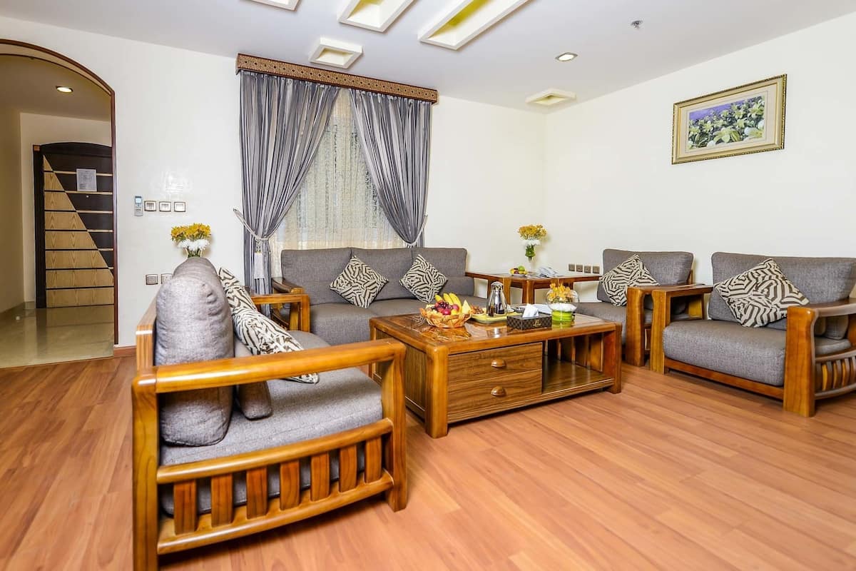 Junior Suite, 1 King Bed, Smoking, City View | Living area | LED TV