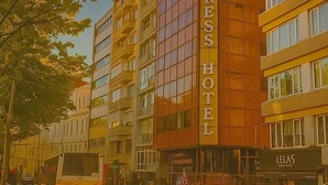 A TAXIMEXPRESS HOTEL building with a modern design, multiple floors, and a prominent sign. - Taxim Express (Istanbul)