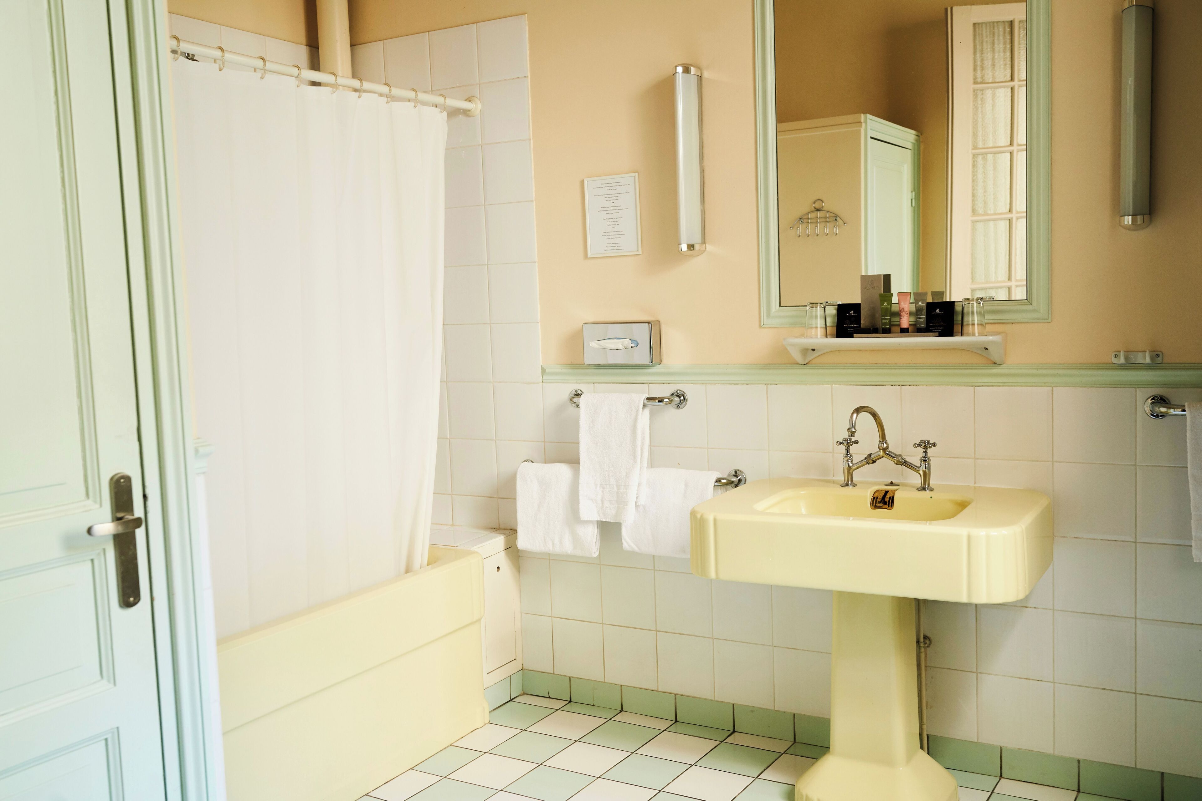 designer toiletries, hair dryer, towels, soap