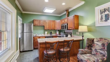 Suite, 1 King Bed, Kitchen, Ground Floor | Private kitchen | Full-size fridge, microwave, oven, stovetop