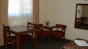 Deluxe Twin Room | Living area | 43-inch Smart TV with satellite channels