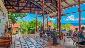 Outdoor pool, open 8:00 AM to 9:00 AM, pool umbrellas, pool loungers