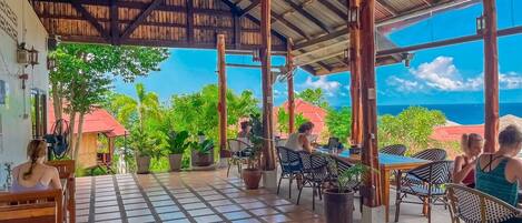 Outdoor pool, open 8:00 AM to 9:00 AM, pool umbrellas, pool loungers