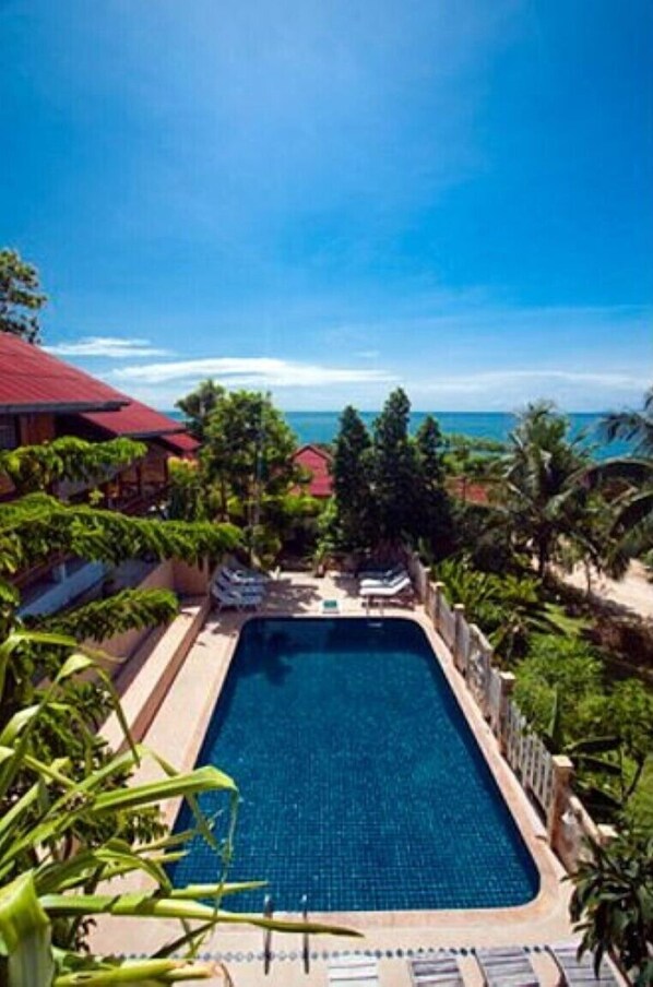 Outdoor pool, open 8:00 AM to 9:00 AM, pool umbrellas, pool loungers