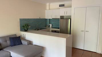 Apartment, 1 Bedroom, Partial Ocean View, Beachfront | Private kitchen | Oven, stovetop, dishwasher, electric kettle