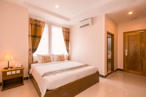 Superior Room | Free minibar items, in-room safe, desk, blackout drapes