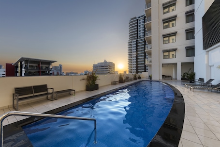 Outdoor pool, sun loungers. Oaks Darwin Elan Hotel