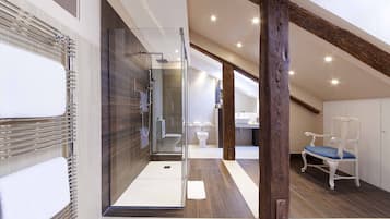 Une salle de bain moderne avec une douche à l’italienne en verre, un banc en bois et un lavabo blanc.