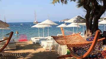 Private beach, sun loungers, beach umbrellas, beach bar