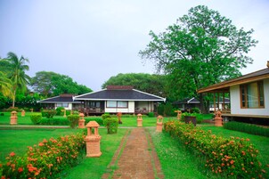 Deluxe Room, River View | Minibar, in-room safe, individually decorated, individually furnished
