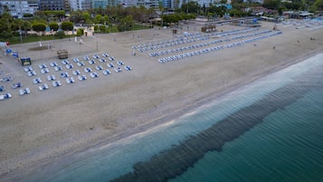 On the beach, beach shuttle, beach cabanas, sun loungers