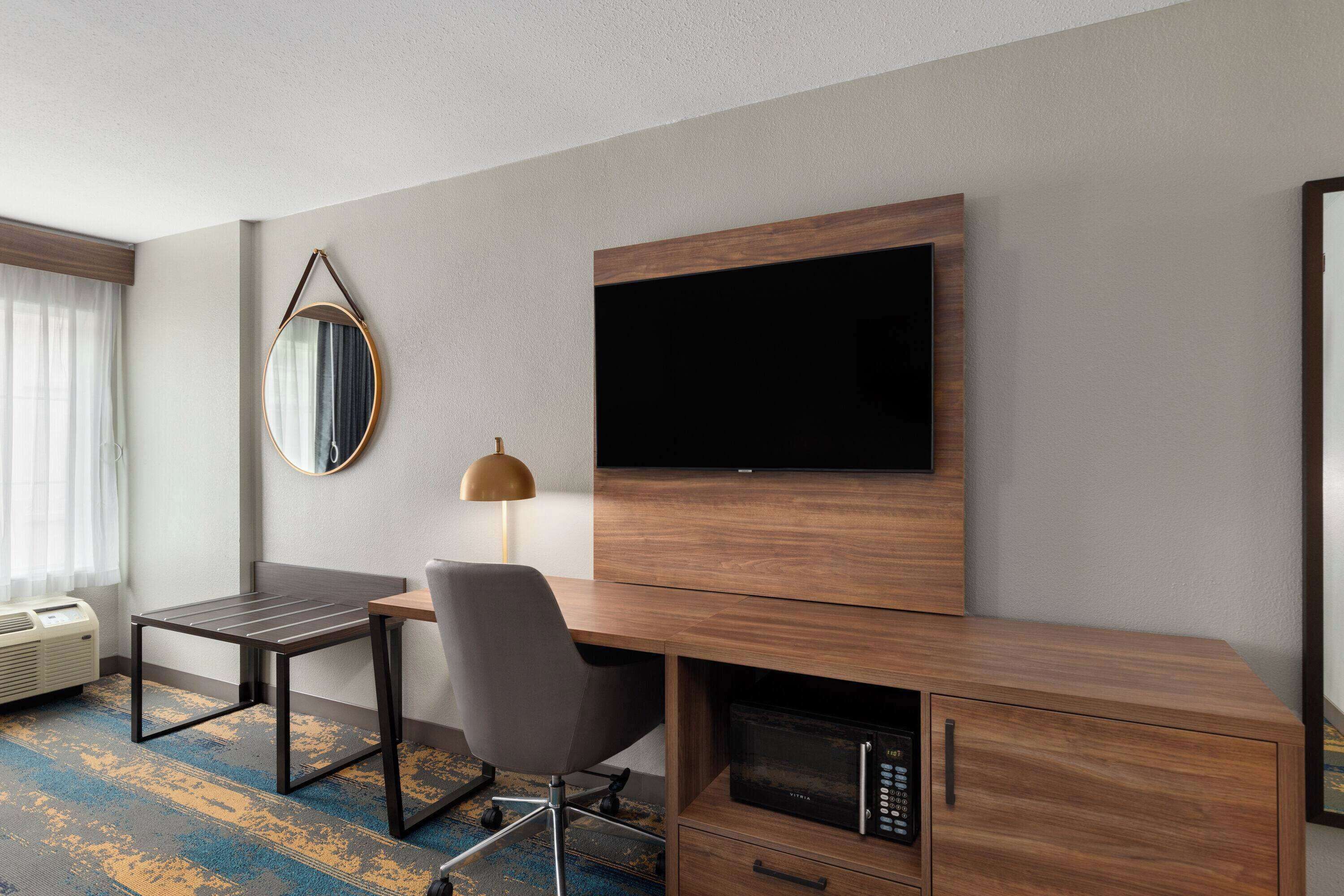 premium bedding, pillow-top beds, desk, laptop workspace