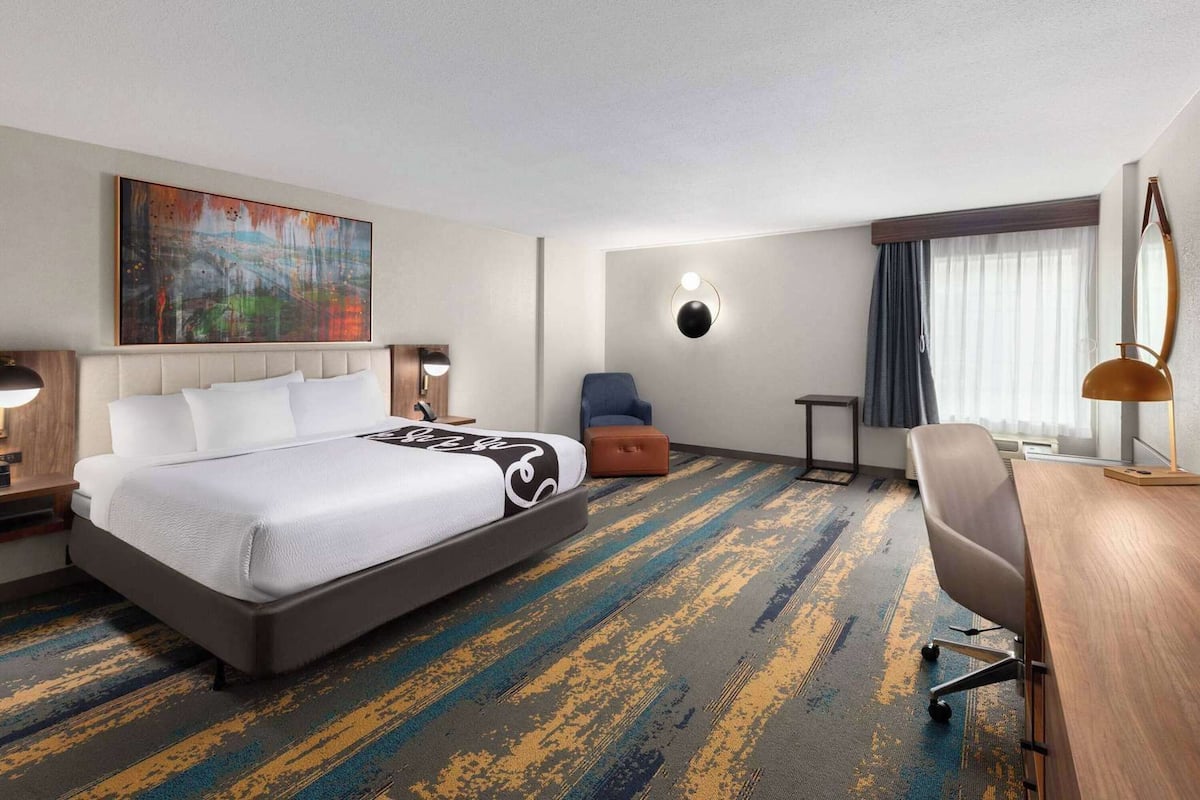 Premium bedding, pillow-top beds, desk, laptop workspace