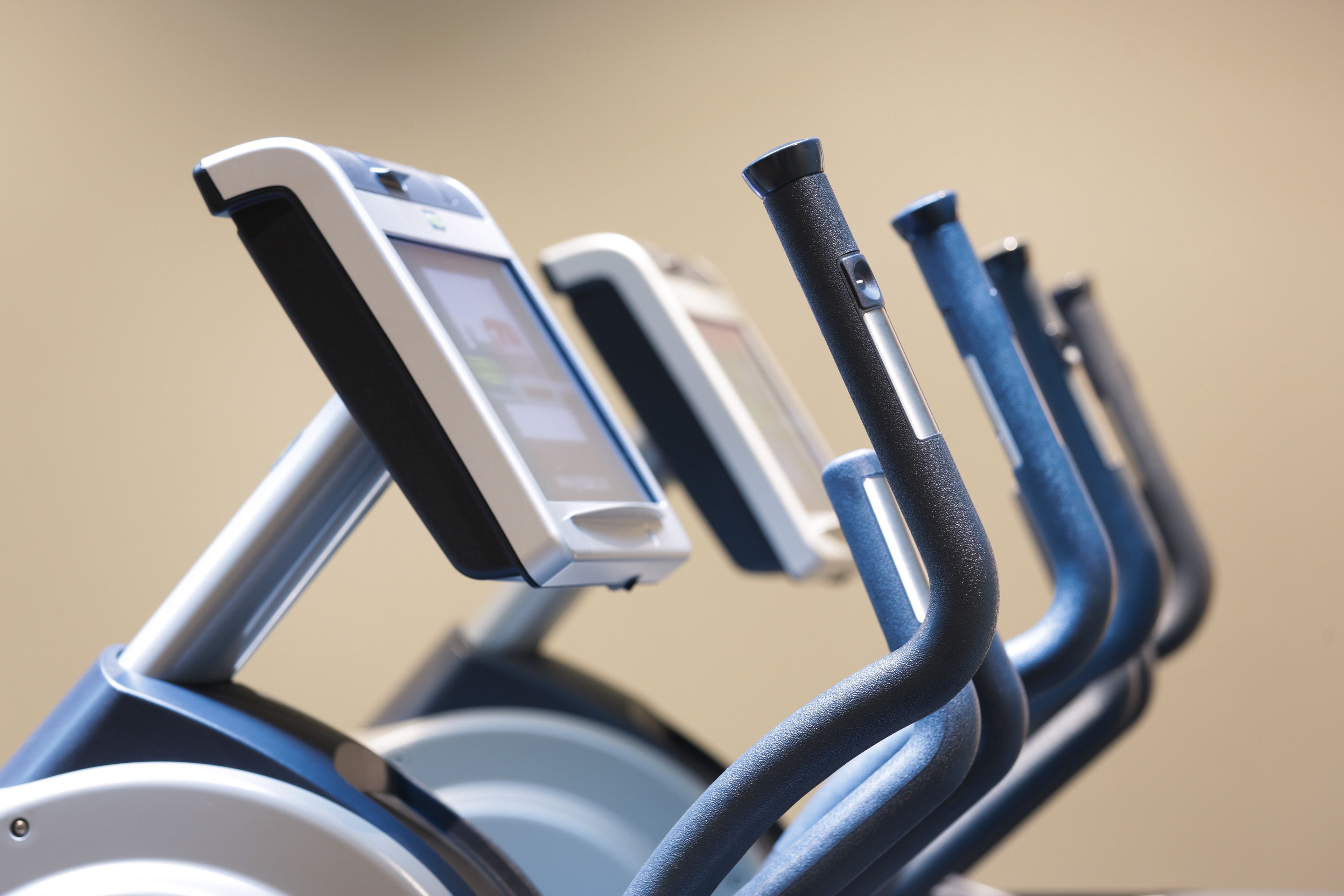 An exercise machine with a digital display and control handles.
