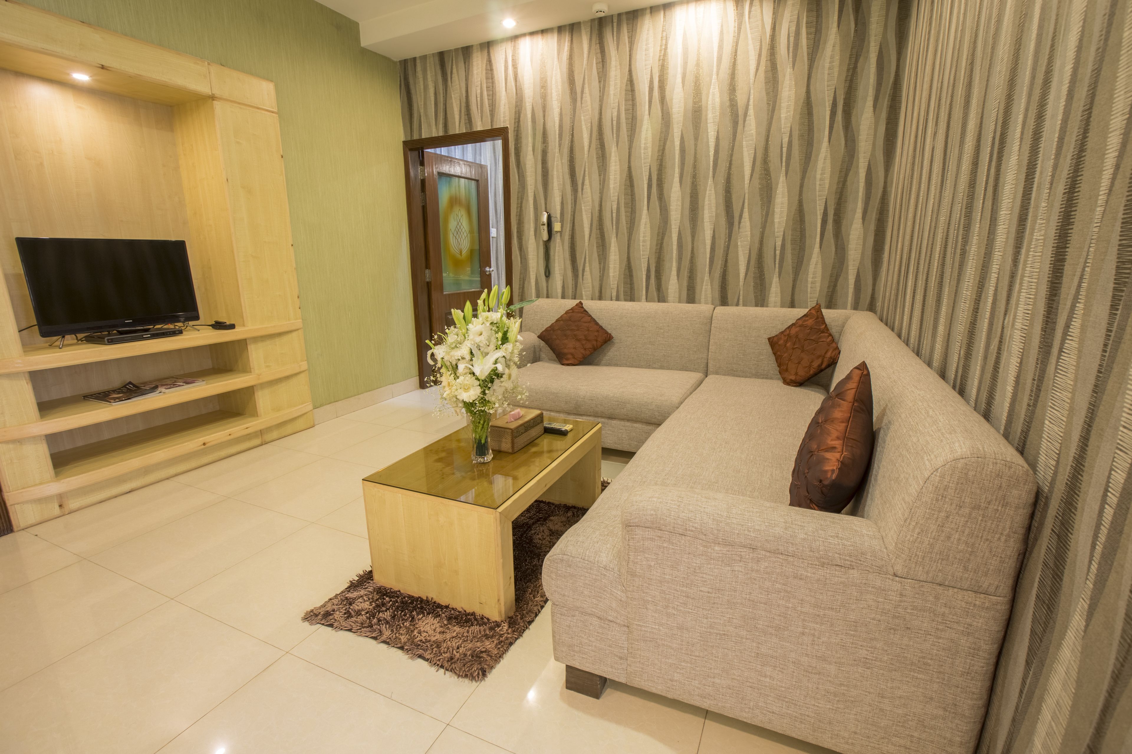 Business Suite, 1 Single Bed | Living room | 32-inch LCD TV with satellite channels, TV, DVD player