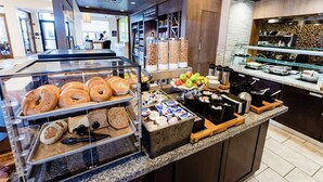 A breakfast buffet with various food items and containers. - Hilton Garden Inn Exton / West Chester (Exton)