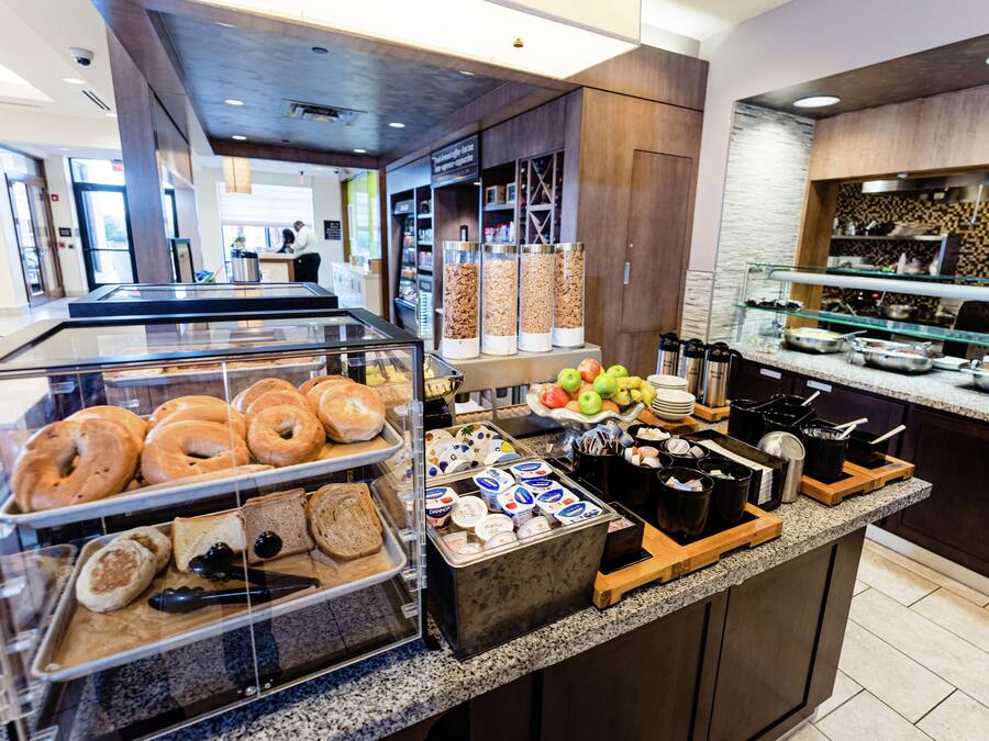 A breakfast buffet with various food items and containers.