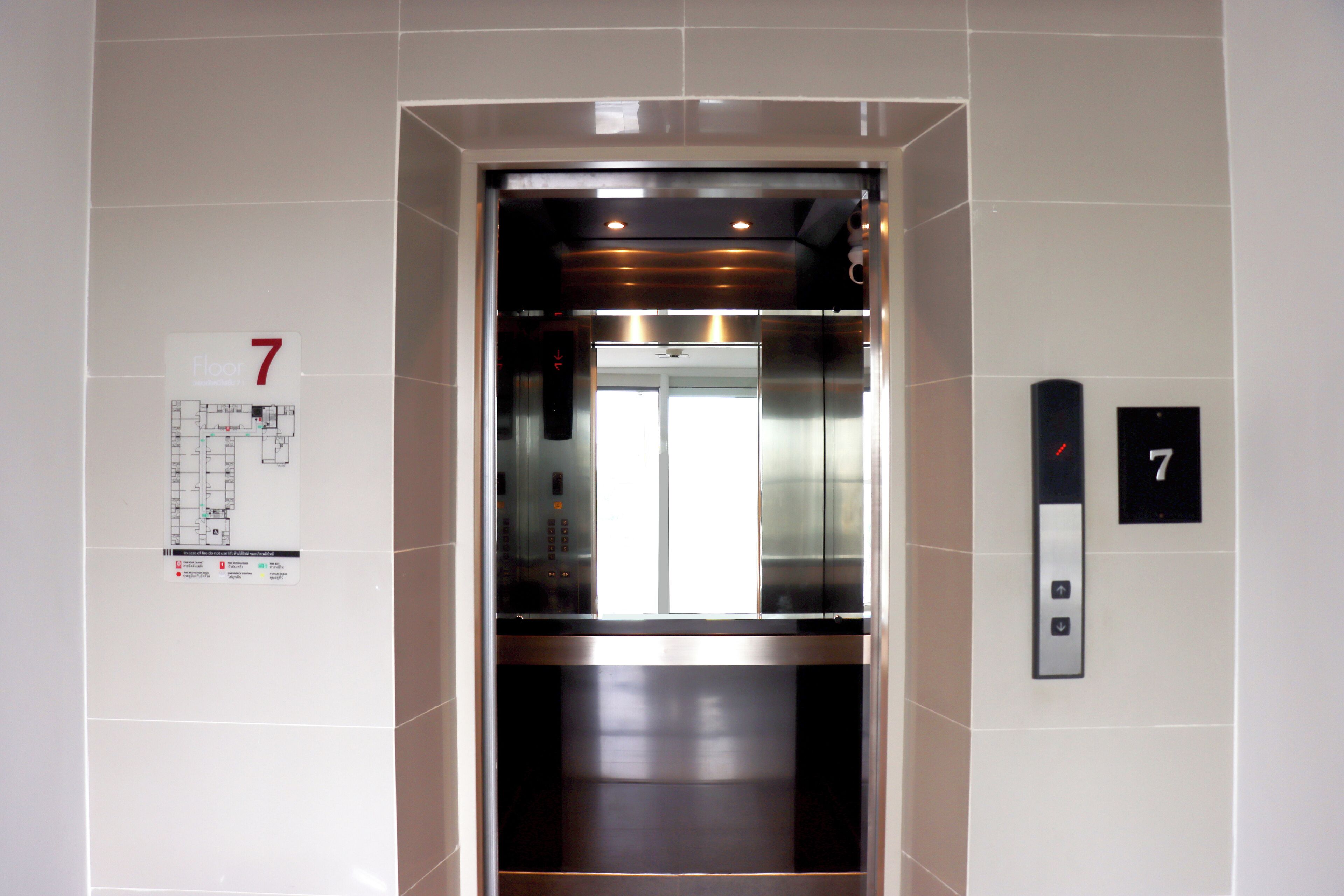An elevator with a floor number sign indicating 7.