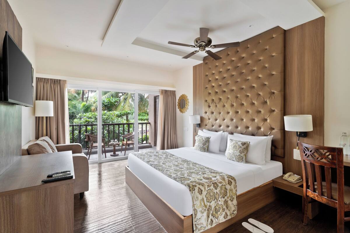 Luxury Room with Garden View with Balcony | Frigobar, cofres nos quartos, Wi-Fi de cortesia, roupa de cama