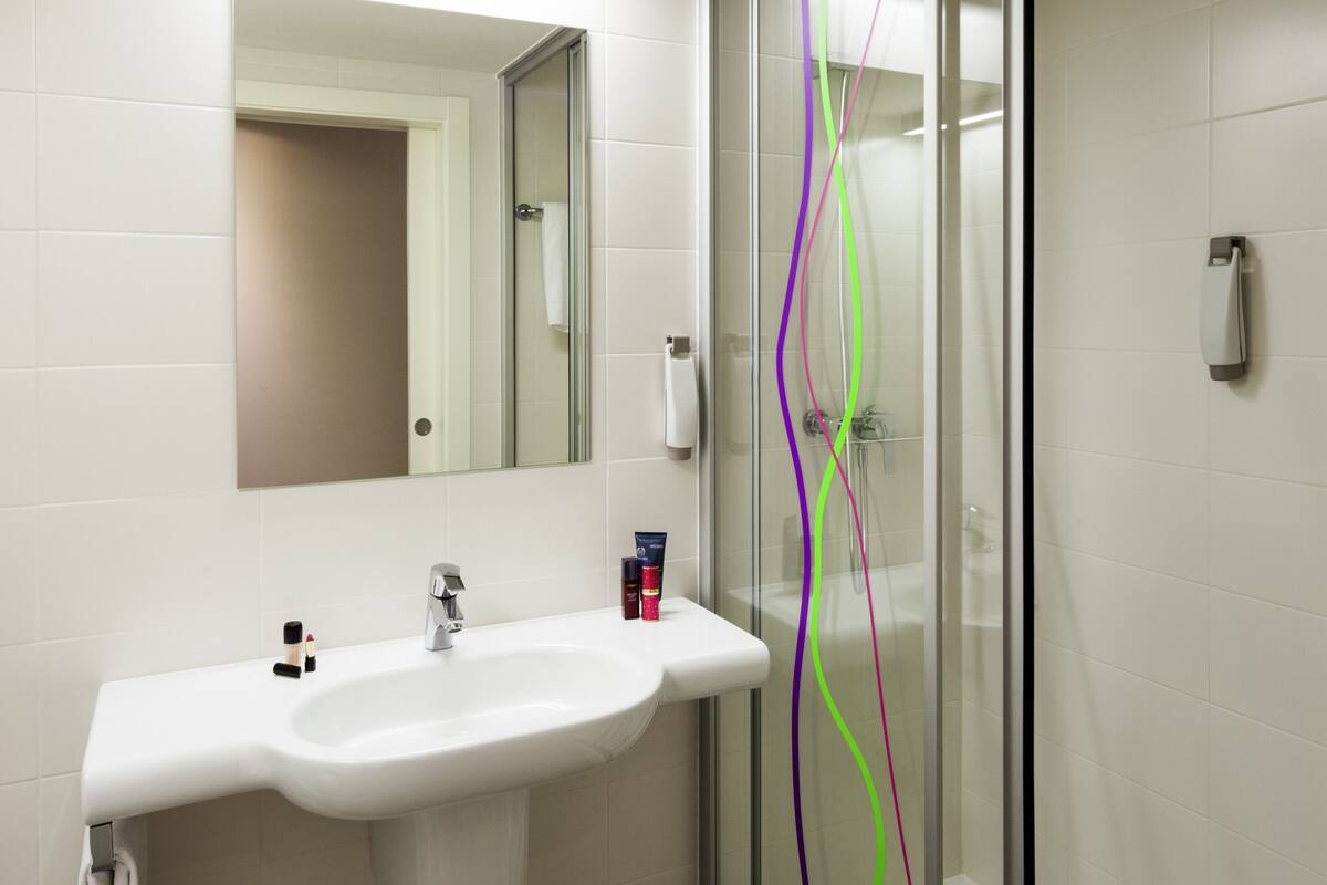 shower, eco-friendly toiletries, hair dryer, towels