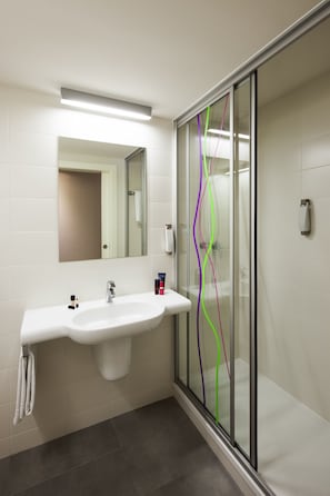 Shower, eco-friendly toiletries, hair dryer, towels