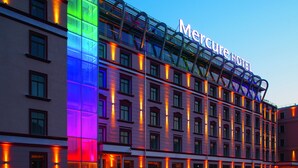 A hotel with a prominent sign reading "Mercure Hotel" and a modern architectural design with multiple floors and balconies. - Mercure Riga Centre (Riga)