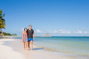 On the beach, white sand, free beach cabanas, sun loungers