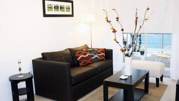 Standard Apartment | Living area | 32-inch LCD TV with cable channels, TV