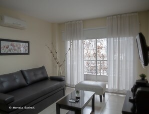 Superior Apartment | Living area | 32-inch LCD TV with cable channels, TV - Arenales Suites (Buenos Aires)