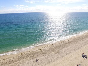 A beach with clear waters and a wide sandy shore. - Best Florida Resort (Lauderdale-by-the-Sea)