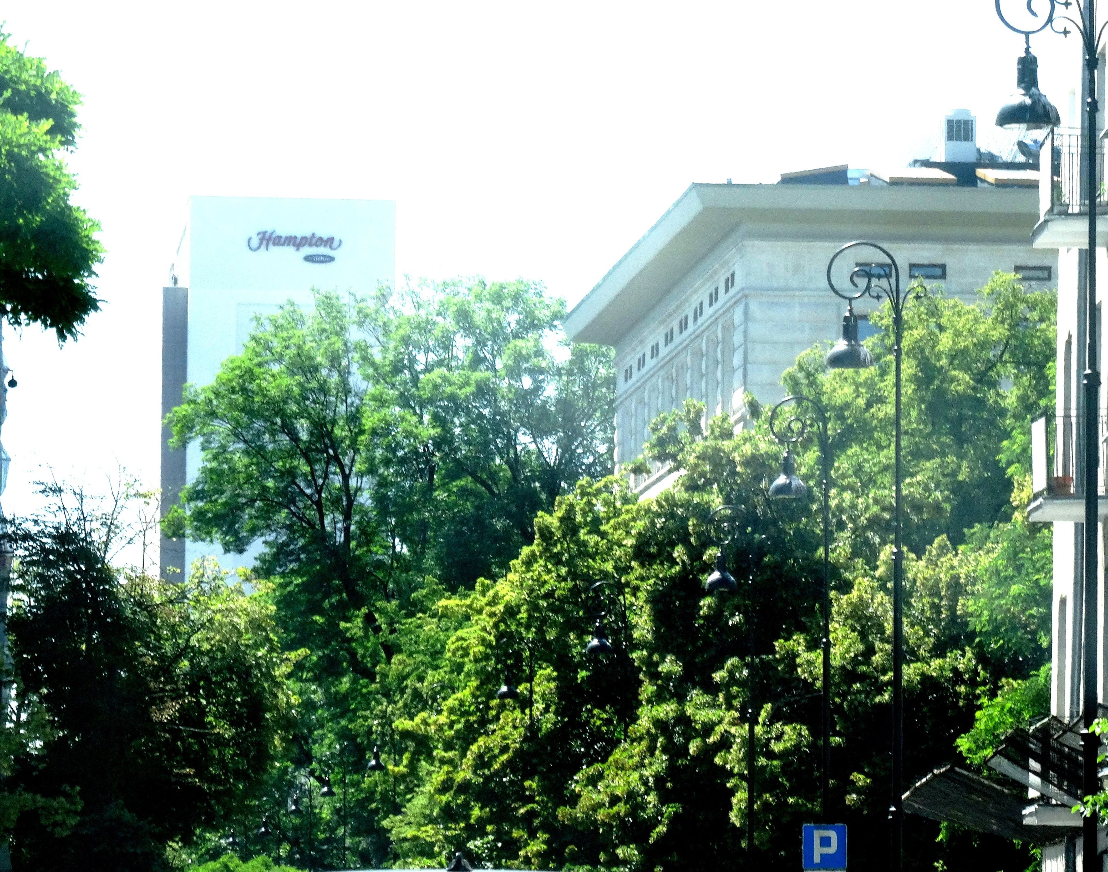 A building with a large sign reading "Champion" and a parking sign.
