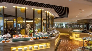 A buffet setup with various food items and a marble floor. - Grand Skylight International Hotel Guiyang (Guiyang)