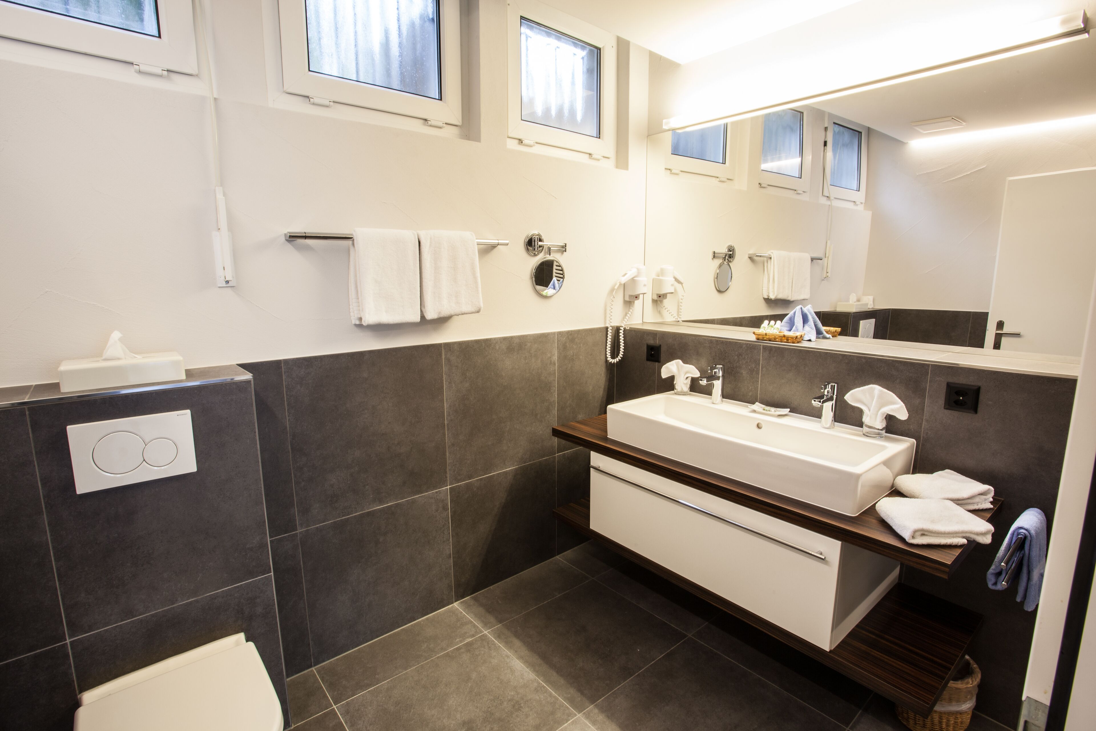 deluxe studio suite | bathroom | free toiletries, hair dryer, towels