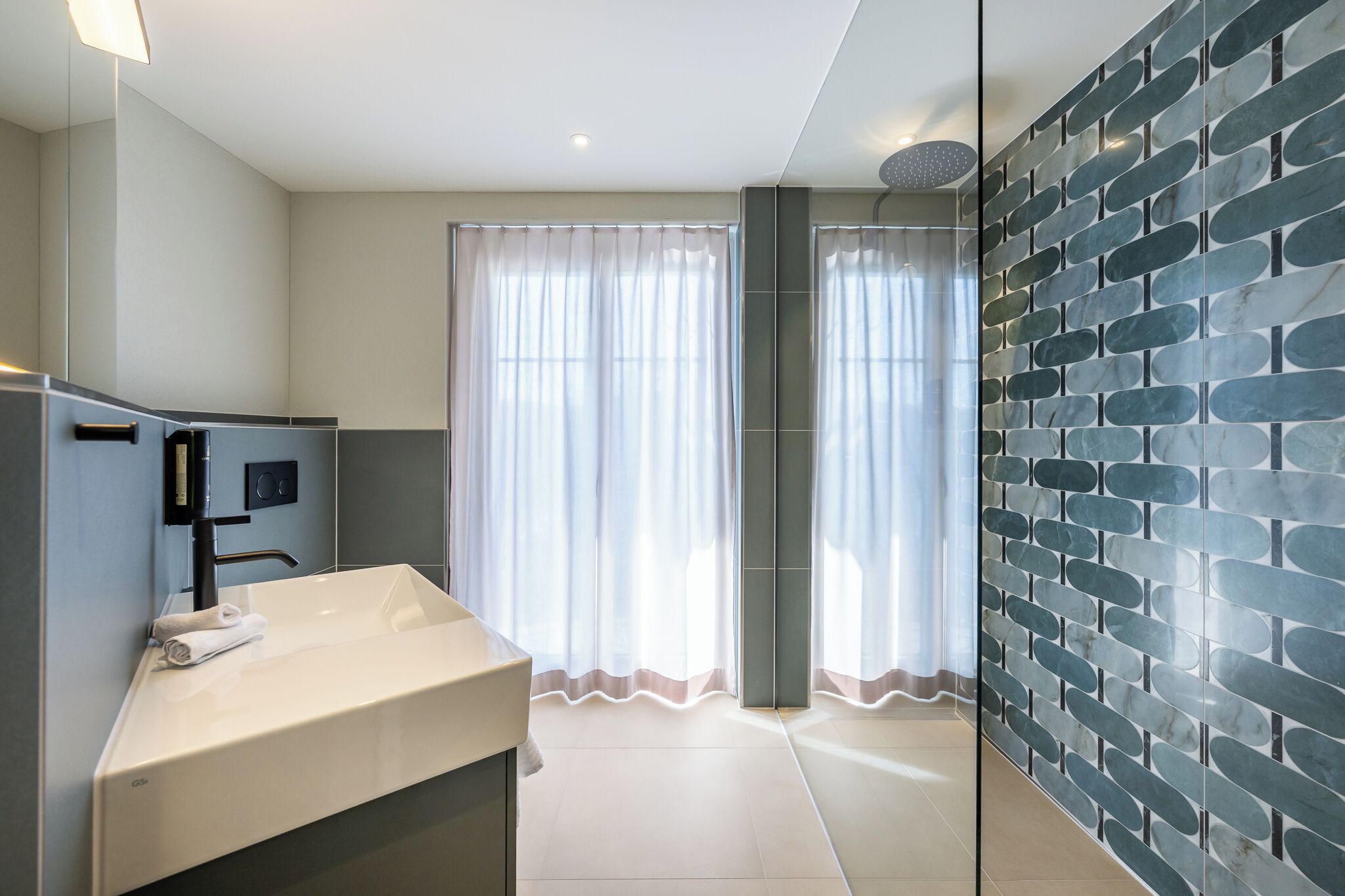 superior double room | bathroom | shower, eco-friendly toiletries, hair dryer, towels