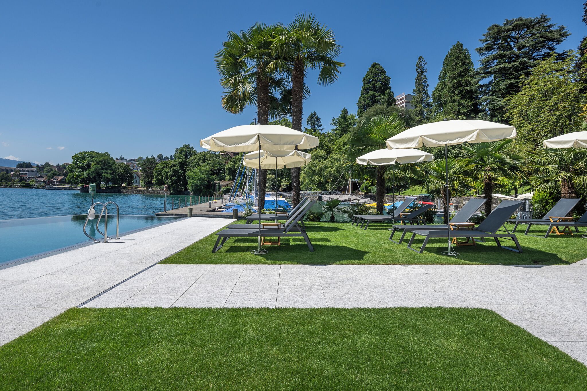 seasonal outdoor pool, pool umbrellas, pool loungers