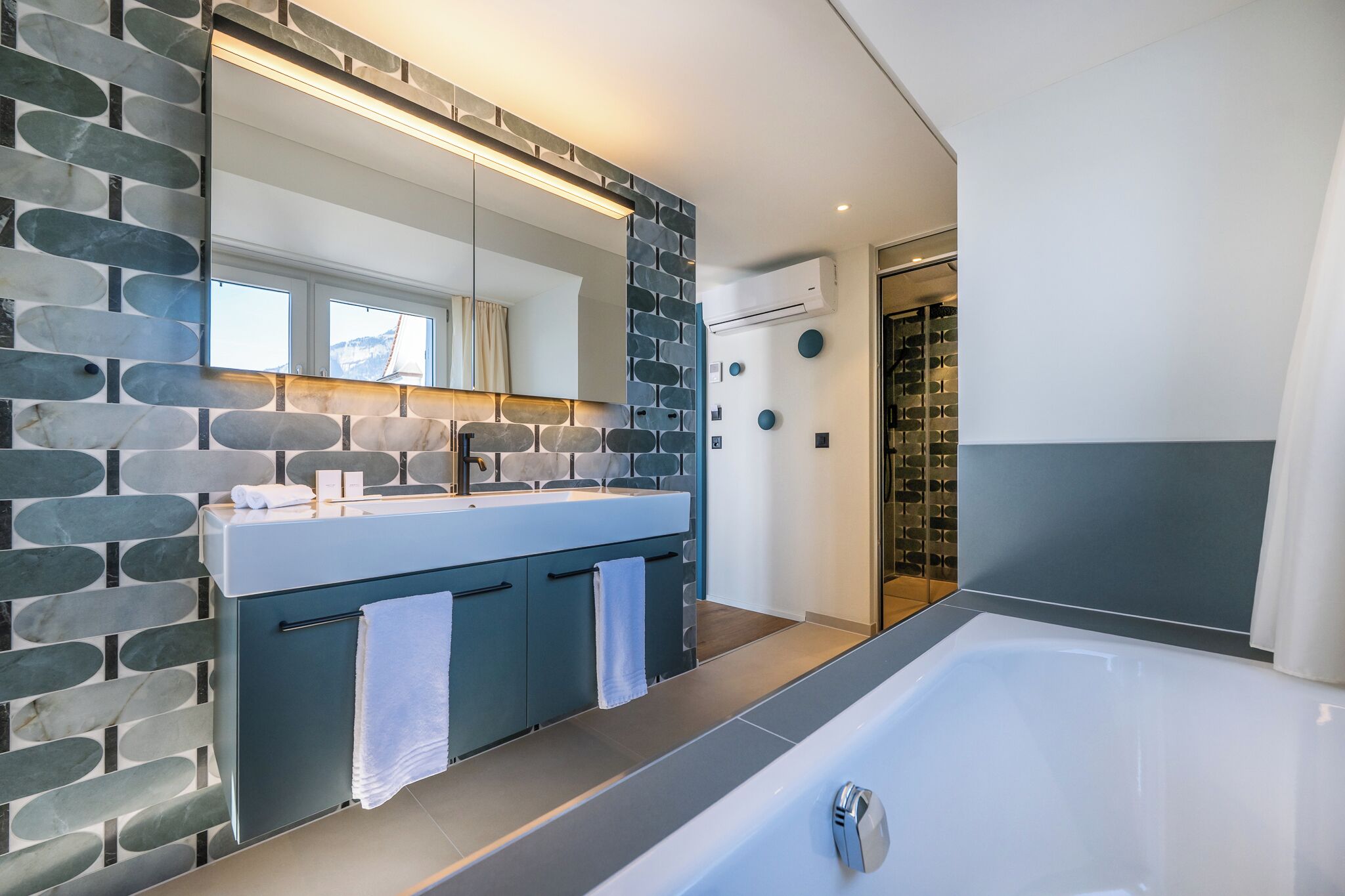 junior double room | bathroom | shower, eco-friendly toiletries, hair dryer, towels