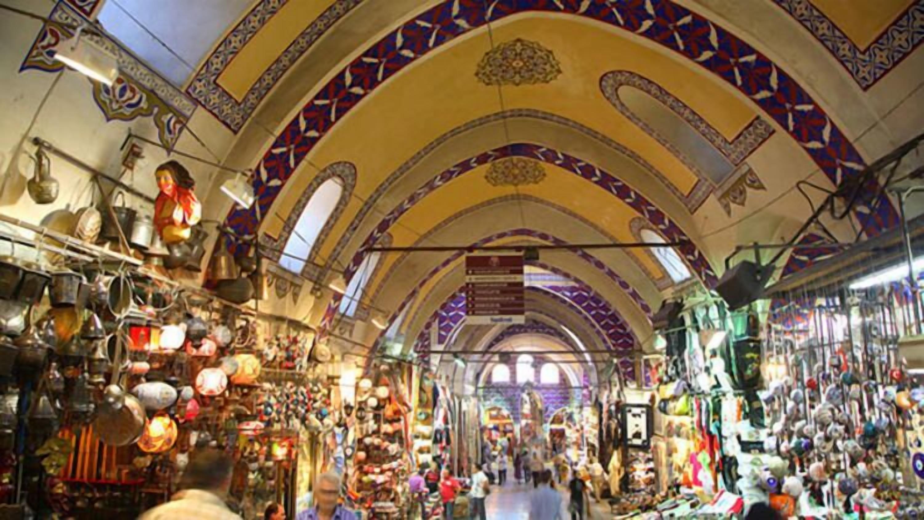 A bustling market with arches and hanging lanterns.