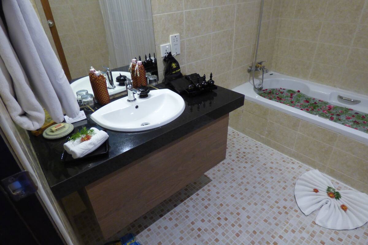 deluxe second sea view | bathroom | shower, free toiletries, hair dryer, bathrobes