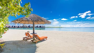 On the beach, sun loungers, scuba diving, snorkeling